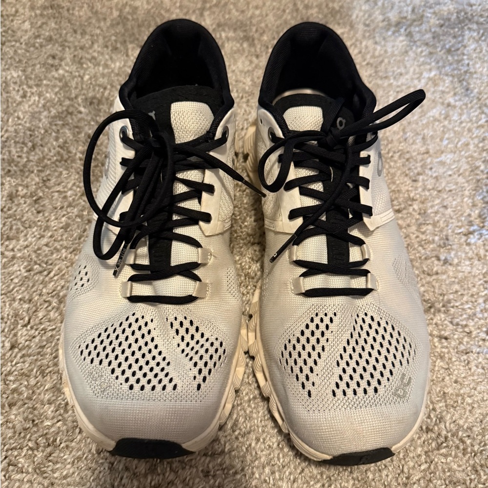On Running White and Black Athletic Shoes